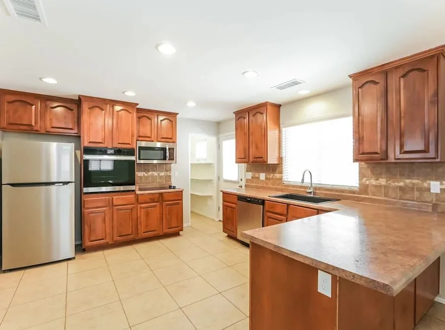 Kitchen remodel with wood cabinets and tile counter