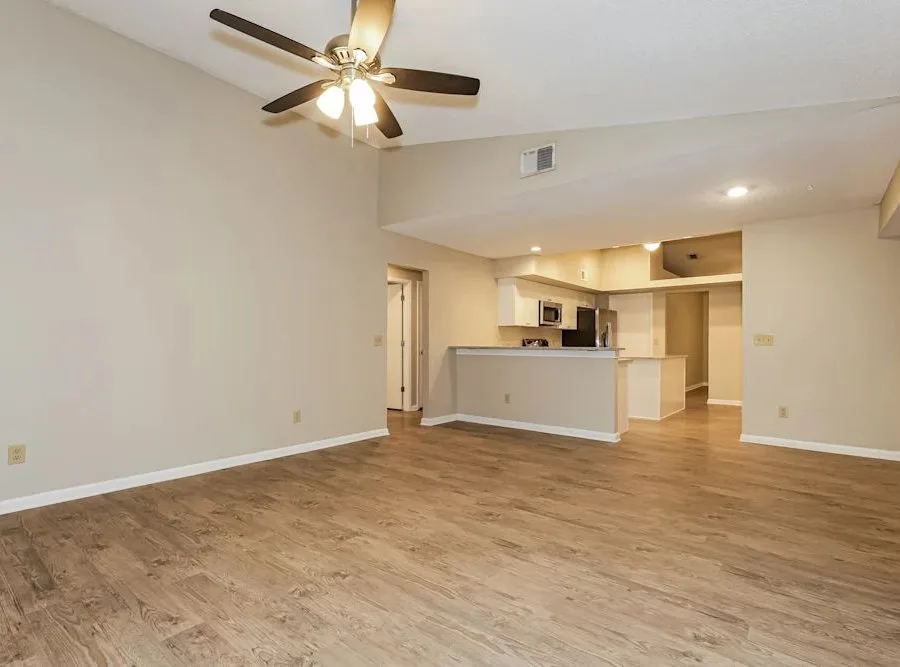 Open interior remodel with kitchen beyond